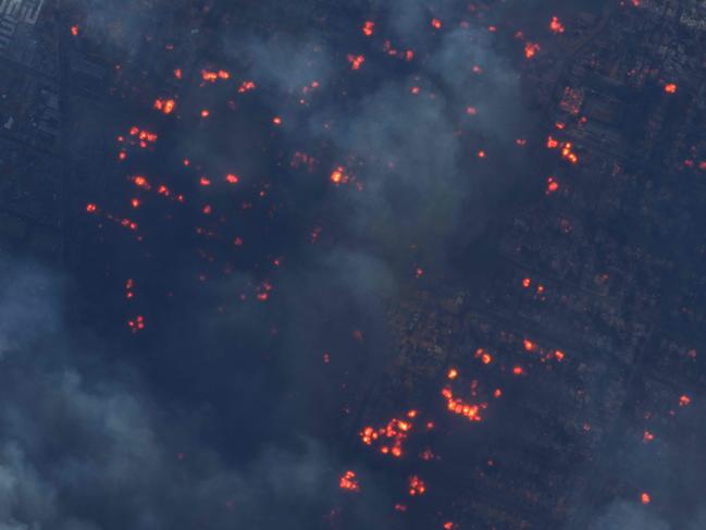 A colour infrared view of burning homes near Fair Oaks Avenue in Altadena, California. Picture: AFP