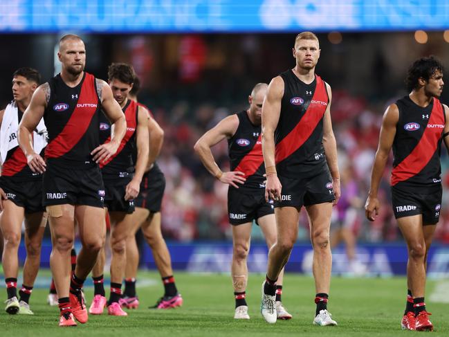 SYDNEY, AUSTRALIA - MARCH 23: Peter Wright of the Bombers and teammates look dejected after the round two AFL match between Sydney Swans and Essendon Bombers at SCG, on March 23, 2024, in Sydney, Australia. (Photo by Matt King/AFL Photos/via Getty Images )