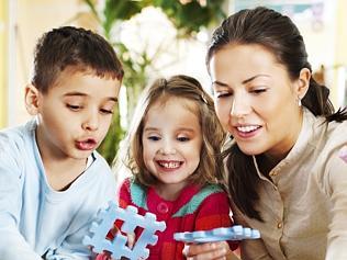 Nursery teacher playing with the kids.