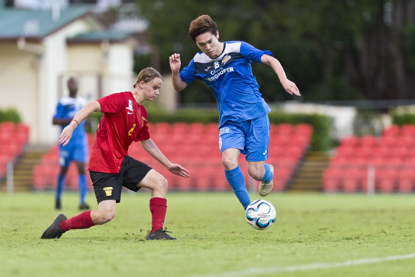 Sunshine Coast Fire player Harrisson Bowen (left) tackles Shota Aizawa of South West Queensland Thunder in NPL Queensland men round nine football at Clive Berghofer Stadium, Saturday, March 30, 2019. Picture: Kevin Farmer