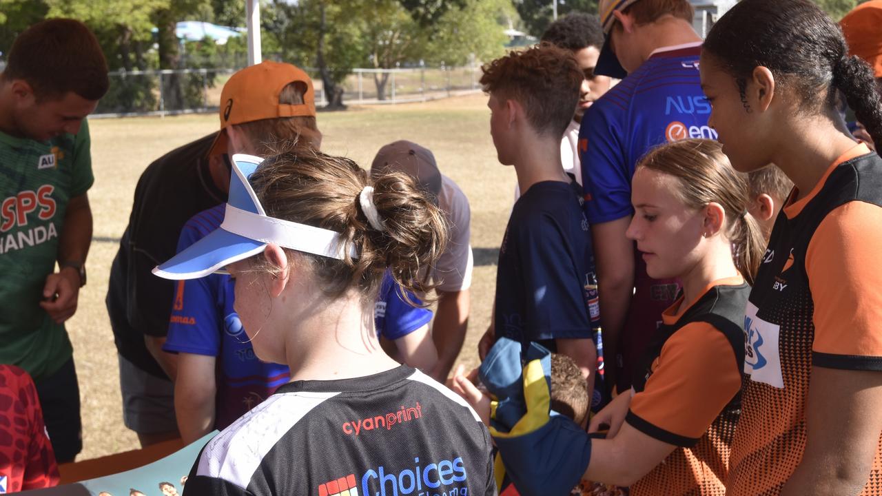 Junior NT Rugby players in line waiting for their posters to be signed by the Australian 7s Men's team. Picture: Darcy Jennings.