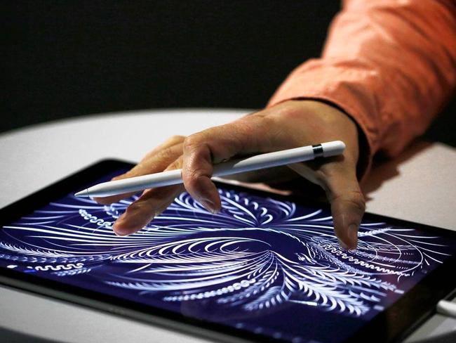 Apple introduced the iPad Pro, measuring 12.9 inches, and a pressure-sensitive stylus called Apple Pencil. PHOTO: STEPHEN LAM/GETTY IMAGES