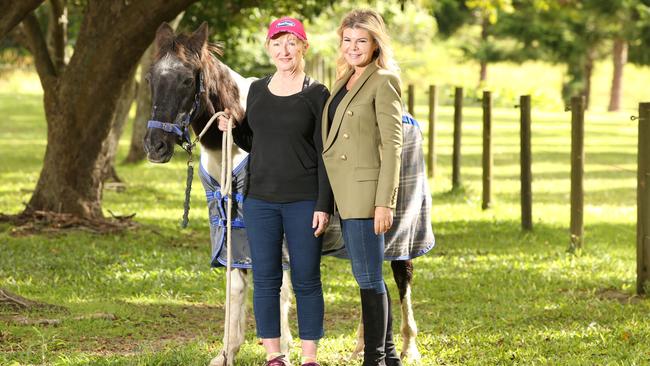 Handler Jenny Dyson-Holland with Marie Nakic and Calypso take a stroll at Belle-Ayr Agistment Centre in the Tallebudgera Valley. Picture Glenn Hampson