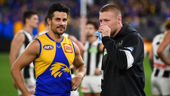 Injured Magpie Jordan De Goey chats with Eagle Liam Duggan after the siren.