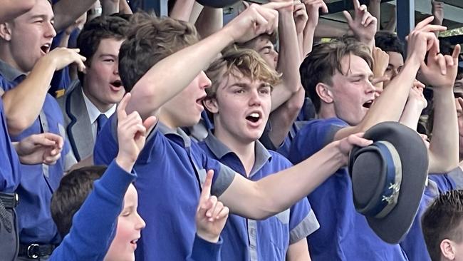 Churchie supporters celebrate a try.