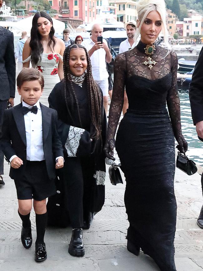 Kim wore a black lace gown as she walked with her daughter, North, and nephew, Reign. Picture: NINO/GC Images