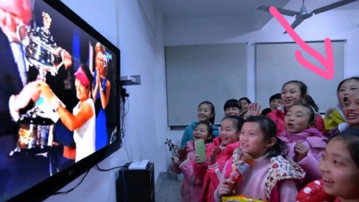 Qinwen Zheng watching Li Na win the Australian Open ten years ago.