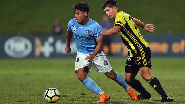 Daniel Arzani (left) in action for Melbourne City in an A-League match against Wellington Phoenix in Auckland in May. Photo: Getty Images