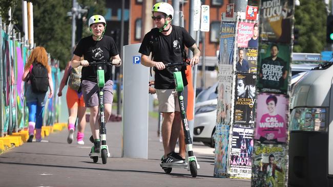 Fringe Festival staff try out the Lime electric scooters – they will be available for public use soon. Picture: Dean Martin