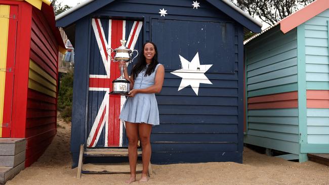 Madison Keys with the 2025 Australian Open winner's trophy on Brighton Beach in Melbourne on Sunday. Picture: Adrian Dennis/AFP