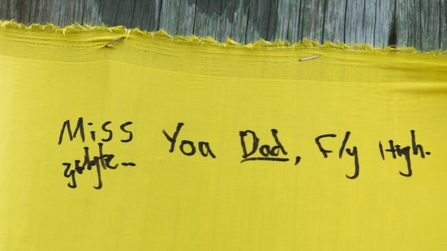 Yellow ribbons and banners, on which people have left messages, have been placed around the town of Gerringong. Picture: Dylan Robinson