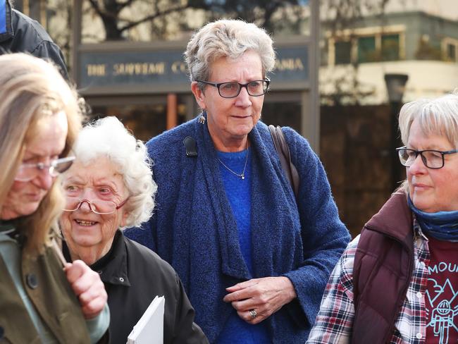 Barbara Etter, Sue Neill-Fraser’s former solicitor, surrounded by supporters outside the Supreme Court of Tasmania on Friday. Picture: NIKKI DAVIS-JONES