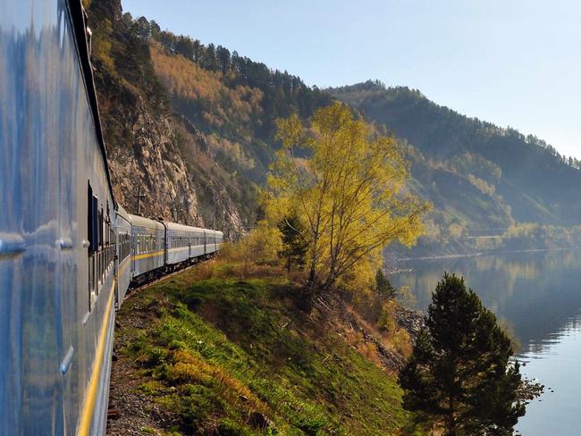 BEST RAIL JOURNEYS OF THE WORLD .. David May story .. Golden Eagle Trans-Siberian Express on the shore of Lake Baikal. Picture: Simon Pielow.