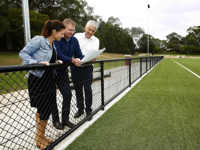 Fiona Martin, Craig Laundy and Starthfield mayor Gulian Vaccari looking over plans for a new amenities building at Strathfield Park. Picture: John Appleyard