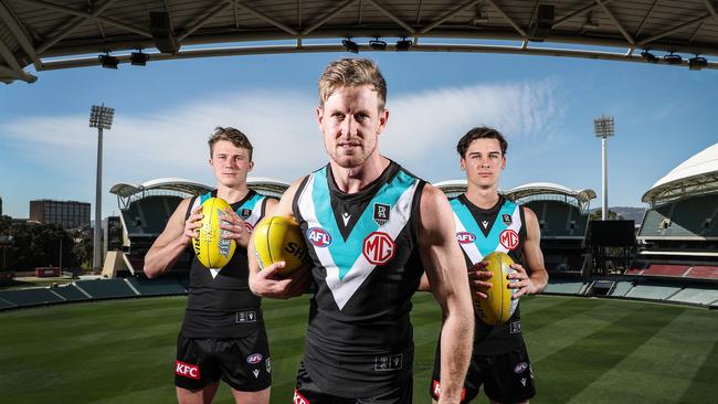 Port Adelaide captain Tom Jonas with Xavier Duursma and Connor Rozee. Picture: Sarah Reed