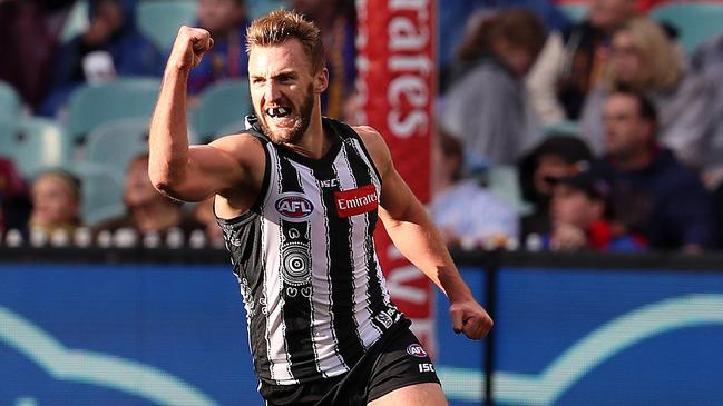 Former Pie and Demon Lyndon Dunn celebrates a goal for Collingwood.