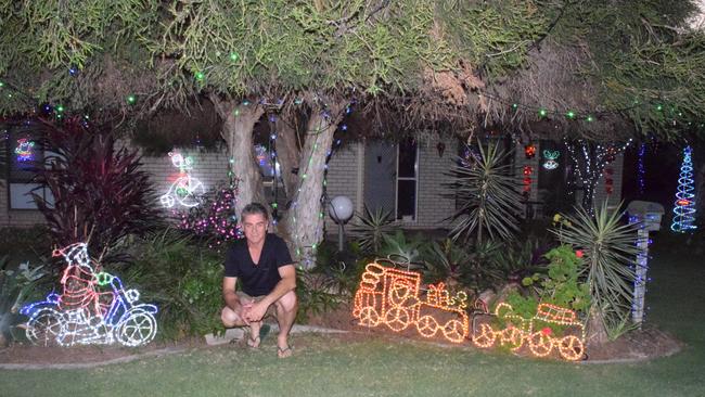 BEST LIGHTS: Chris McKinley showing off some of his winning Christmas lights in last year’s Biloela Home Timber and Hardware Christmas Lights Competition.