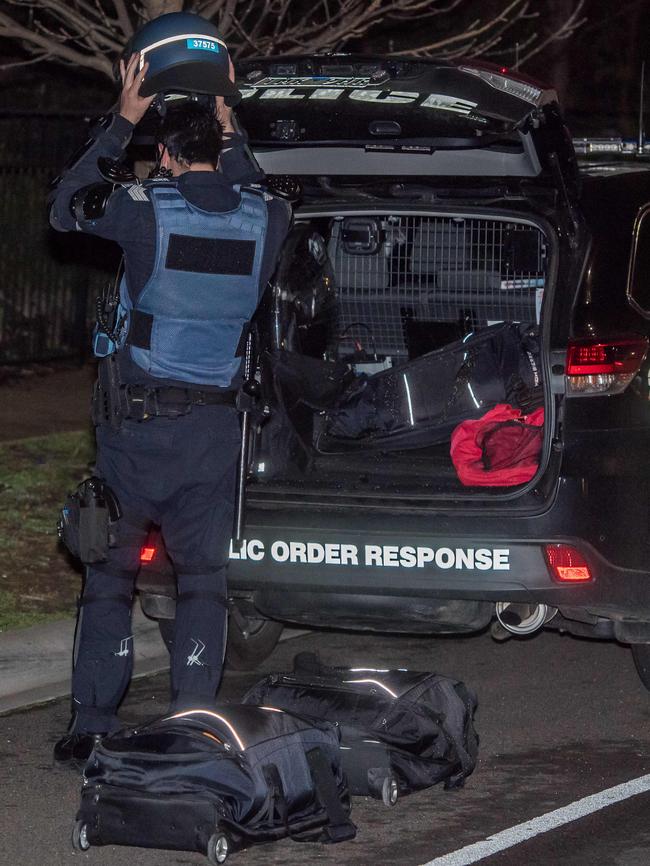 Police wore riot gear for protection. Picture: Jason Edwards