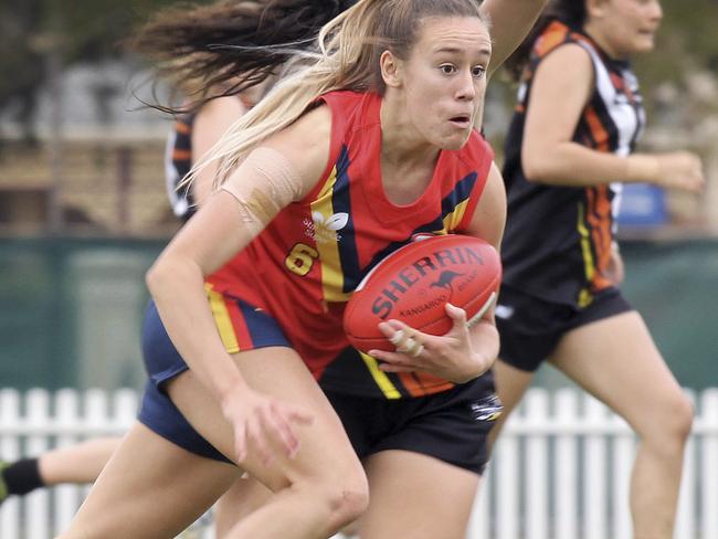 Round One of the 2019 NAB AFLW Under-18 Championships began today, Friday, May 31   at Peter Motley Oval, Unley, South Australia between South Australia and Northern Territory. SA's Hannah Munyard wins the ball again. Picture Dean Martin