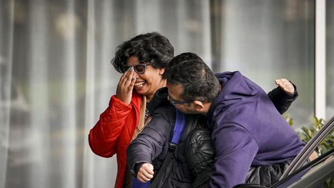 A family is jubilant after leaving mandatory quarantine in Adelaide. Photo: MIKE BURTON