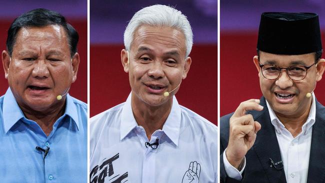 Indonesia's presidential candidates Ganjar Pranowo (C), Prabowo Subianto (L) and Anies Baswedan speaking during the first presidential election debate in Jakarta.