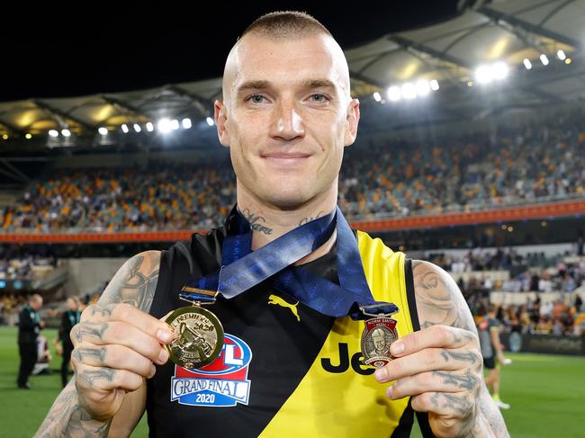 BRISBANE, AUSTRALIA – OCTOBER 24: Dustin Martin of the Tigers celebrates with his Norm Smith Medal and Premiership Medal during the 2020 Toyota AFL Grand Final match between the Richmond Tigers and the Geelong Cats at The Gabba on October 24, 2020 in Brisbane, Australia. (Photo by Michael Willson/AFL Photos via Getty Images)