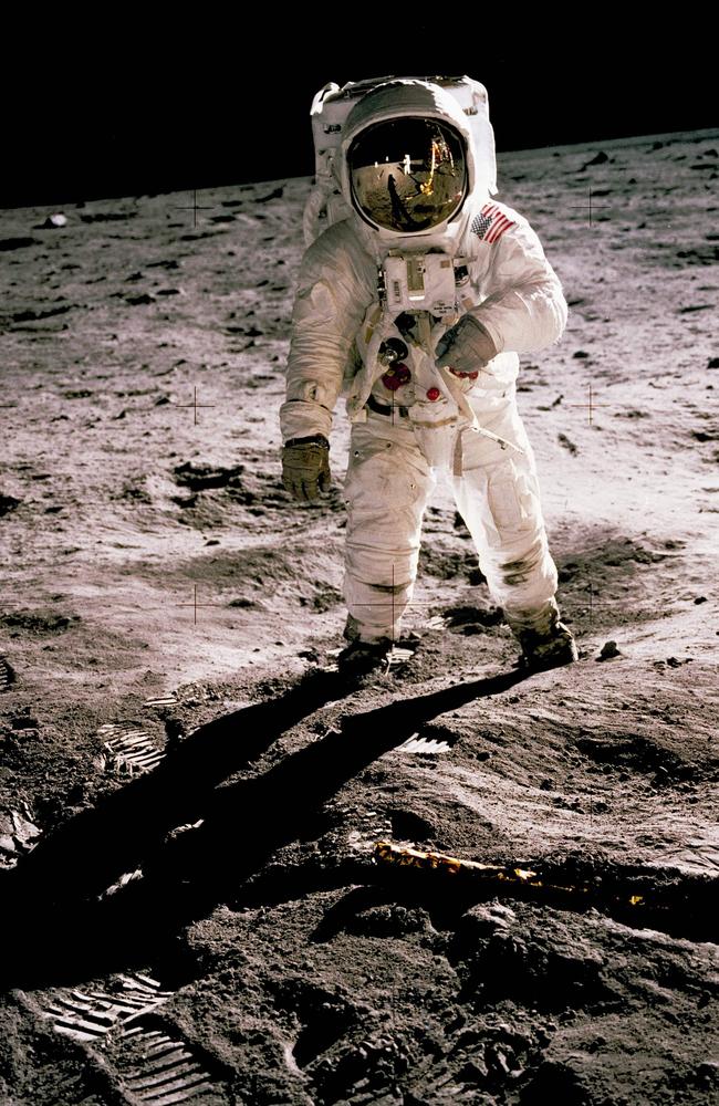 This photo obtained from NASA and taken by Neil Armstrong (reflected on helmet) shows Edwin "Buzz" Aldrin walking on the Moon on July 20, 1969. — When the Saturn V rocket built by Wernher von Braun launched with the Apollo 11 capsule at its summit on July 16 1969, one million people flocked to watch the spectacle on the beaches of Florida near Cape Canaveral. But many had doubts that they'd succeed in landing this time. Picture: Neil Armstrong/NASA/AFP