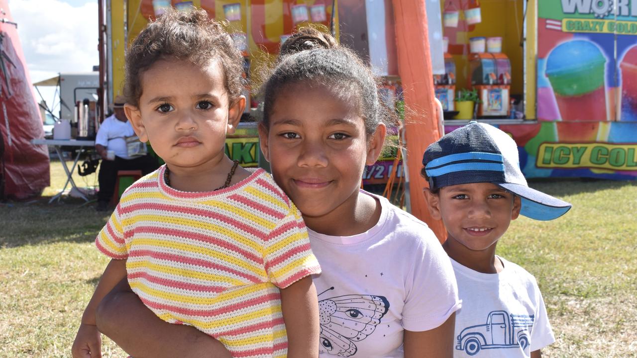 Maddison Nona of Bowen, with siblings Zoey and Tupoa, loved the UFO ride at the Bowen Show. Picture: Kirra Grimes