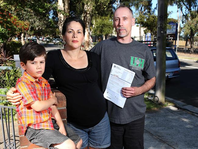 Mr Burke with wife Maria and son Alex with the parking fine.