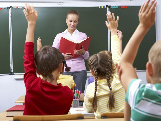 Generic image of teacher teaching students inside school classroom.