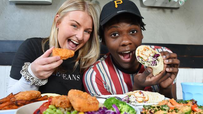 Clare Cromie and Mpho Mpofu test out Hunky Dory’s fishless fish menu at its Eastland store. Picture: Josie Hayden