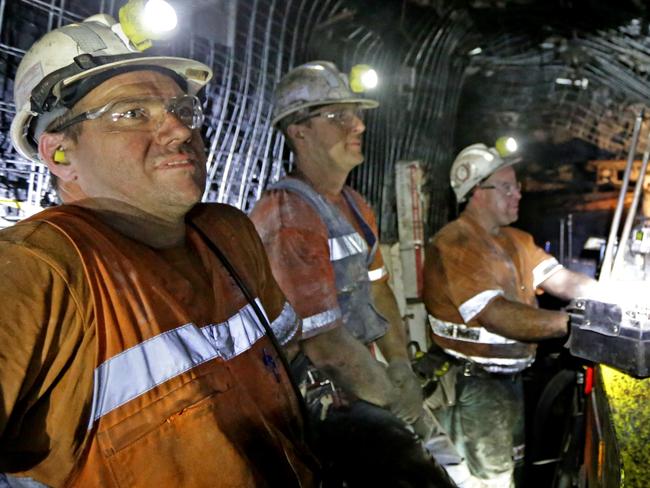 Workers on the continuous miner bore into the coal seam to create an access tunnel for the Longwall miner at BHP Billiton Mitsubishi Alliance (BMA) Broadmeadow underground coal mine. The mine uses a Longwall Top Coal Caving (LTCC) method, slicing along the seam face, to extract the coal without removing the surrounding rock. This high quality coal is then blended with open cut coal to produce Goonyella Coking Coal.