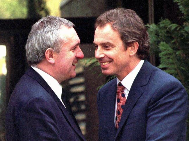 Then Irish leader Bertie Ahern and his British counterpart Tony Blair shake hands after a peace agreement is reached.