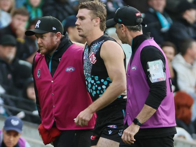 ADELAIDE, AUSTRALIA - MAY 17: Jason Horne-Francis of the Power comes off injured during the 2025 AFL Round 10 match between Yartapuulti (Port Adelaide Power) and the Geelong Cats at Adelaide Oval on May 17, 2025 in Adelaide, Australia. (Photo by James Elsby/AFL Photos via Getty Images)