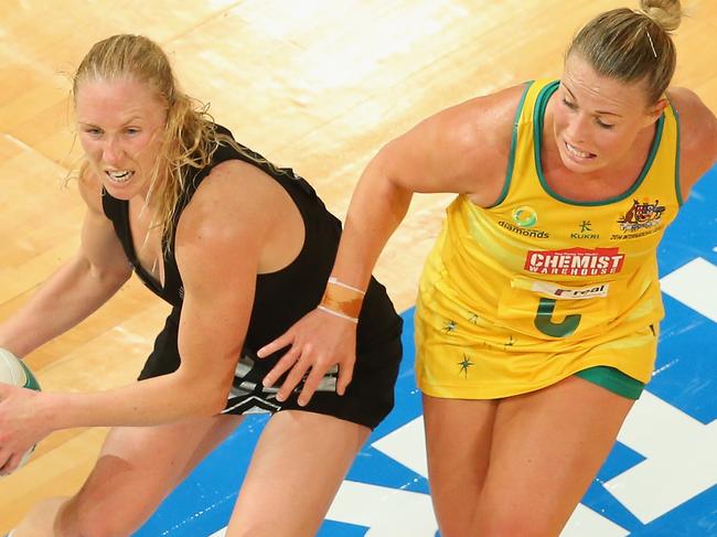 MELBOURNE, AUSTRALIA - OCTOBER 08: Laura Langman of the Silver Ferns and Kimberlee Green of the Diamonds compete for the ball during the International Test match between the New Zealand Silver Ferns and the Australian Diamonds at Hisense Arena on October 8, 2014 in Melbourne, Australia. (Photo by Scott Barbour/Getty Images)