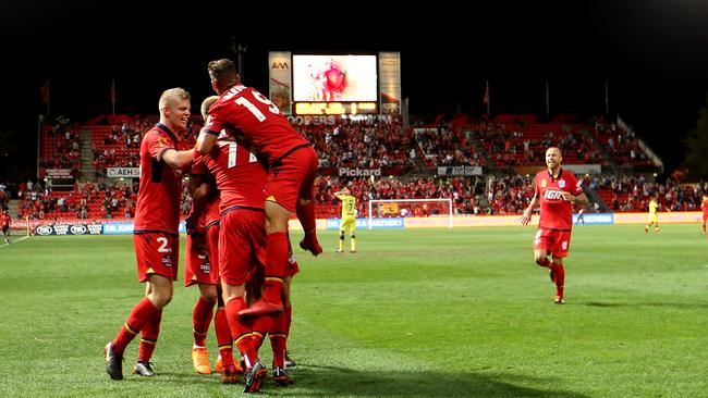 Adelaide United celebrate a goal against the Mariners. Picture: AAP / James Elsby