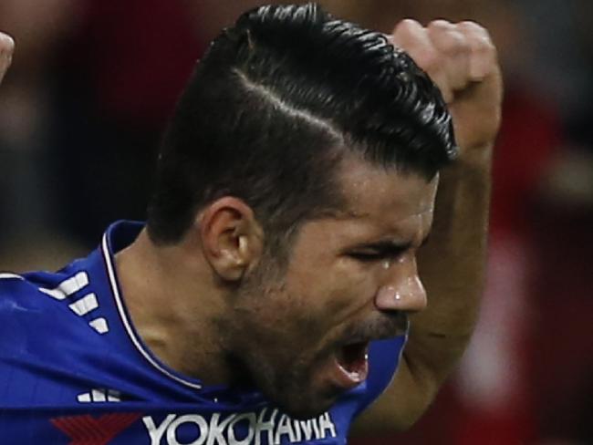 Chelsea's Brazilian-born Spanish striker Diego Costa celebrates after scoring the opening goal of the English Premier League football match between Arsenal and Chelsea at the Emirates Stadium in London on January 24, 2016. AFP PHOTO / IKIMAGES RESTRICTED TO EDITORIAL USE. No use with unauthorized audio, video, data, fixture lists, club/league logos or 'live' services. Online in-match use limited to 75 images, no video emulation. No use in betting, games or single club/league/player publications.