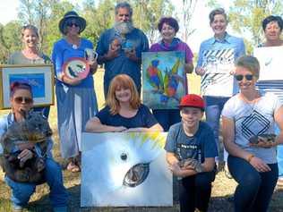 Carole Elliott, Tricia Greinke, Kim Warcon, Gail Meyer, Erin Dunne, Sandra Harald, Tina Jansen (with Wiggles the wombat), Emma Ward, Jack Davis (with a blue tongue) and Susie Allcock (with a shingleback) are raising funds for wildlife rescue and research. Picture: Jann Houley