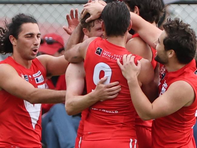 Roosters players celebrate a goal during the Round 4 SANFL match between North Adelaide and Woodville West Torrens at Prospect Oval in Adelaide, Sunday, April 30, 2023. (SANFL Image/David Mariuz)