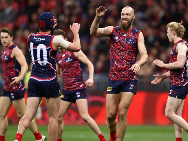 SYDNEY, AUSTRALIA - JUNE 04: Max Gawn of the Demons is congratulated by team mates after kicking a goal during the round 12 AFL match between the Melbourne Demons and the Brisbane Lions at GIANTS Stadium on June 04, 2021 in Sydney, Australia. (Photo by Cameron Spencer/AFL Photos/via Getty Images)