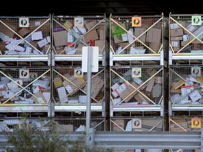 The Australia Post bulk parcels distribution centre at Chullora is inundated with packages during the Covid 19 lockdown with drivers struggling to keep up with all the online shopping that has increased due to shops and retail outlets being closed. Picture: Toby Zerna