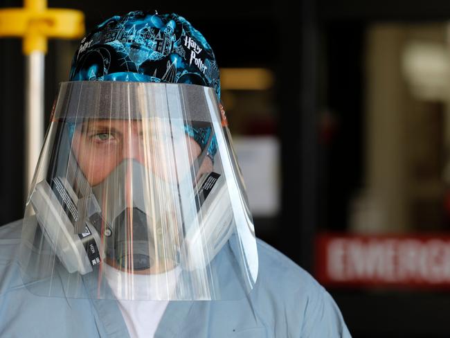 (FILES) In this file photo Canadian nurse Steve Homick is photographed outside of the Emergency Entrance at Beaumont Hospital in Royal Oak, Michigan on April 26, 2020. - Border restrictions were being tightened around the world on January 25, 2021 in the face of an unrelenting coronavirus threat, after a weekend in which anger at social distancing rules bubbled over into fiery clashes in the Netherlands. The United States was set to join France, Israel and Sweden in pulling up the drawbridge to certain arrivals, with special concern about new strains of the pathogen that originated in Britain and South Africa. (Photo by JEFF KOWALSKY / AFP)