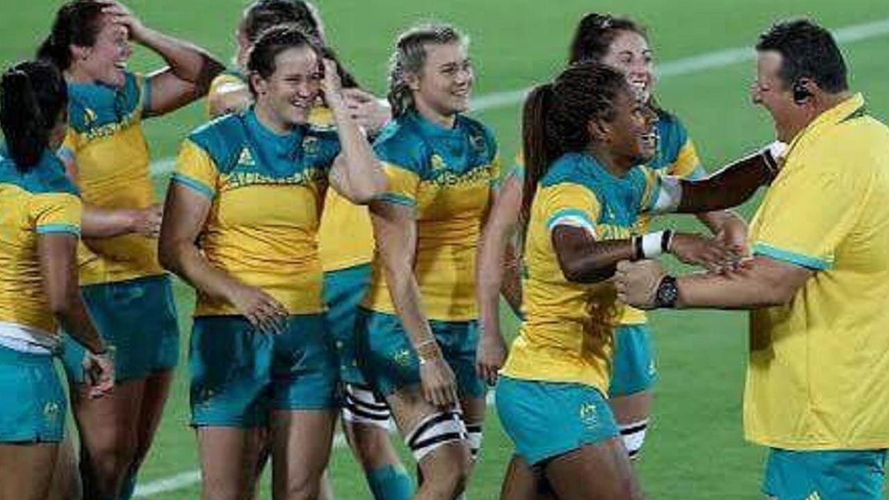 John Manenti congratulates the women’s sevens team after they won gold in Rio.