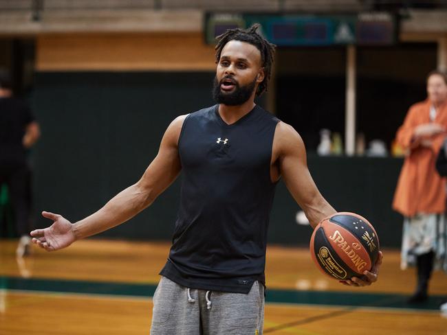 WARNING - UNDER EMBARGO UNTIL SUNDAY 8TH JULY - DO NOT USE WITHOUT SPEAKING TO ST PIC ED JEFF DARMANIN. Australian NBA star, Patty Mills, pictured in Sydney today during a basketball clinic for kids at Trinity Grammar School. Picture: David Swift.