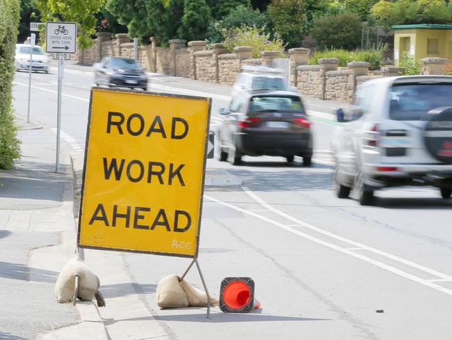 Roadworks sign on Sandy Bay road. Traffic, road works, development, transit. generic