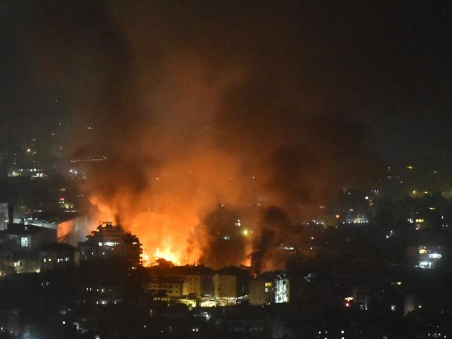 TOPSHOT - Smoke billows from the site of an Israeli airstrike that targeted a neighborhood in Beirutâs southern suburb early on September 28, 2024. The Israeli army said September 28 that it killed the commander of Hezbollah's missile unit in southern Lebanon in an air strike, along with his deputy and several other leaders of the Iran-backed movement. Israeli fighter jets killed "Muhammad Ali Ismail, the commander of Hezbollah's missile unit in southern Lebanon, and his deputy," the military said in a statement on Telegram that added, "other Hezbollah commanders and terrorists were eliminated". (Photo by Fadel ITANI / AFP)