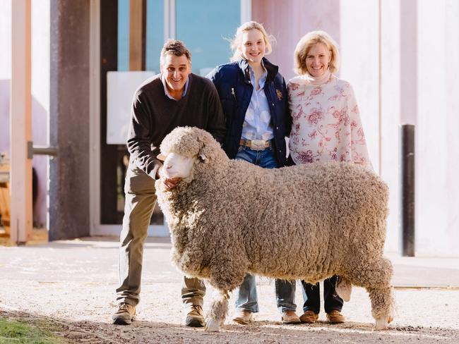 Top price: Chris, Cindy and Cilla Clonan, 17, from Alfoxton Merino stud in Armidale, NSW, with their $26,000 ram they sold at Bendigo at the weekend. Picture: Chloe Smith