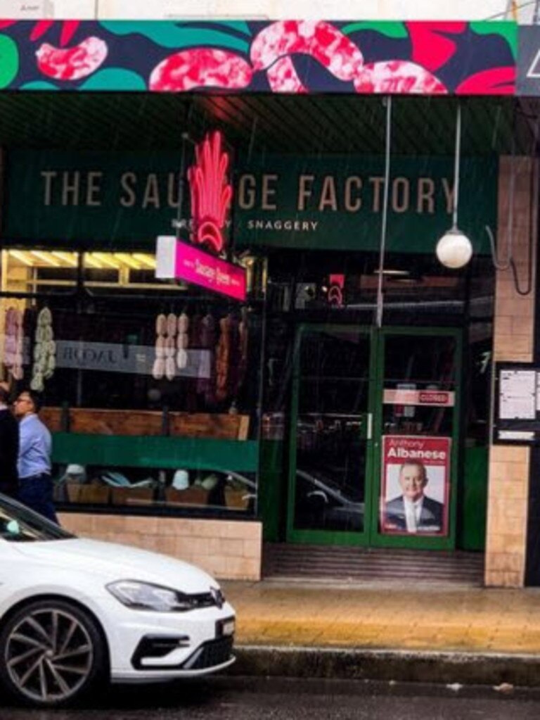 The Sausage Factory has an Anthony Albanese election poster in its window.