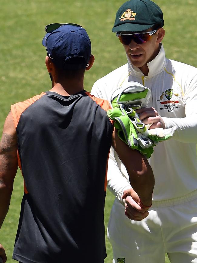 Kohli shakes hands with Aussie captain Tim Paine after the second Test. Pic: AFP