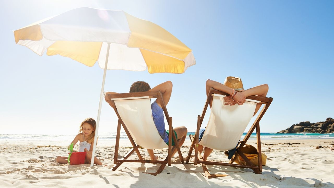 Have fun in the shade with these top-rated beach umbrellas. Picture: iStock/pixdeluxe.